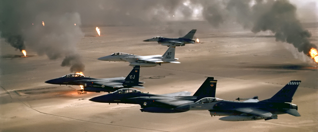Two F-15E Strike Eagles accompanied by a single F-15C Eagle and two F-16 Fighting Falcons over Kuwait during Operation Desert Storm in 1991